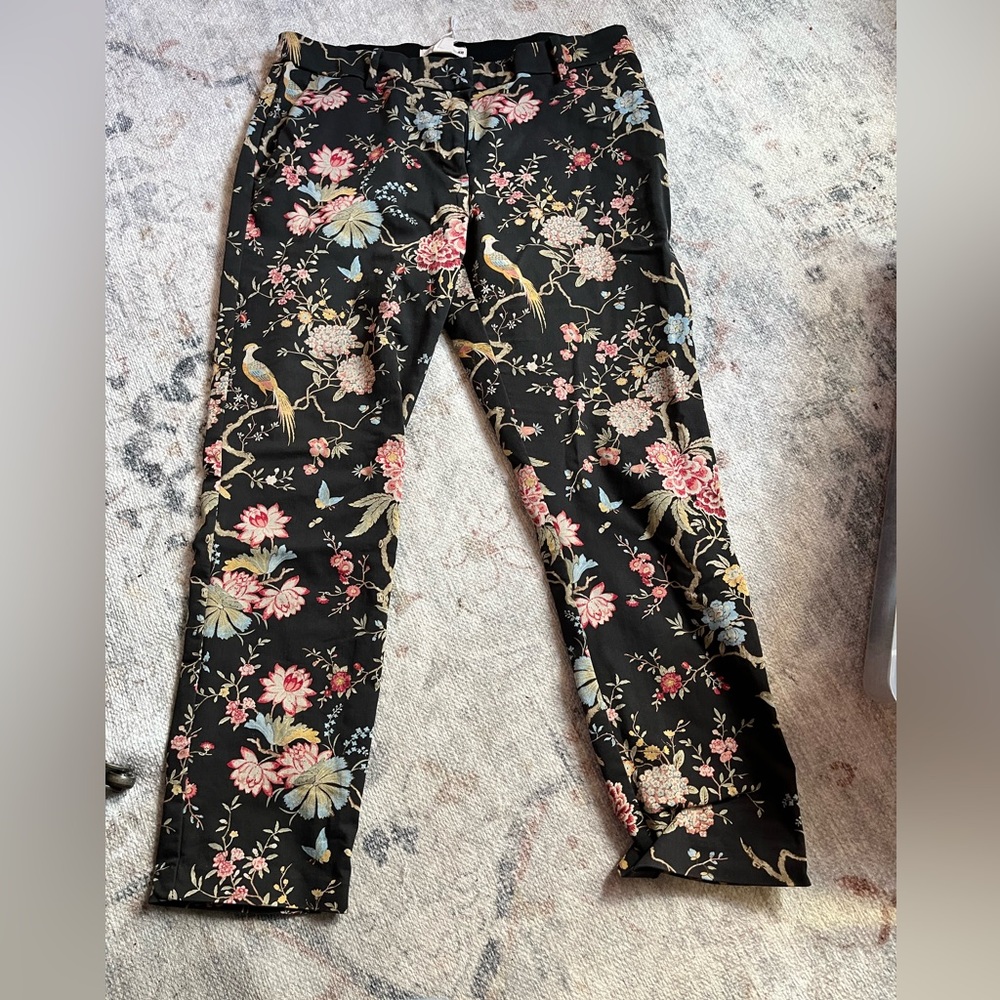 Floral/ bird print pants with black background.